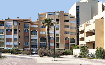 Le Barcarès 260: Water, Sky, Building, Plant, Property, Blue, Window, Azure, Swimming Pool, Tree