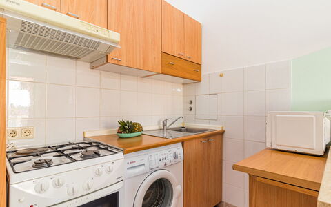Nicole: Cabinetry, Building, Laundry Room, Countertop, Washing Machine, Clothes Dryer, Kitchen Appliance, Kitchen Stove, Kitchen, Home Appliance