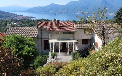 Colombaio: Plant, Sky, Window, Plant Community, Mountain, Building, Land Lot, Vegetation, Tree, Residential Area