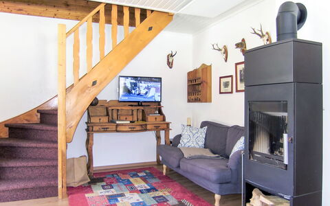 Fischerhütte: Room, Furniture, Property, Interior Design, Building, House, Living Room, Bed, Wood-Burning Stove, Loft
