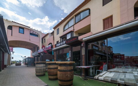 Le Barcarès 400: Property, Sky, Table, Wood, Shade, Floor, Outdoor Furniture, Chair, Flooring, Wood Stain