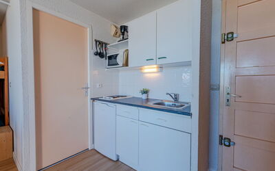 Front de Mer 400.8: Cabinetry, Property, Kitchen, Countertop, Wood, Interior Design, Building, Floor, Flooring, Major Appliance