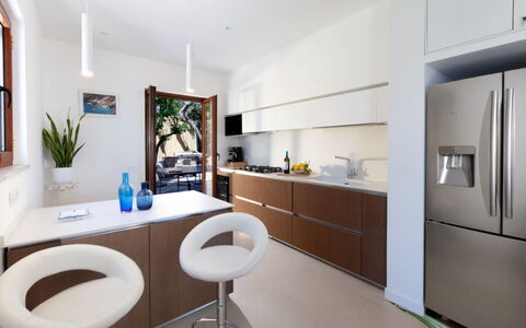 Villa Nerano: Furniture, Interior Design, Kitchen, Countertop, Flooring, Cabinetry, Kitchen Appliance, Floor, Wood, Ceiling