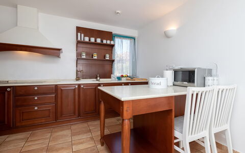 Villa Bugenvila: Furniture, Room, Property, Cabinetry, Kitchen, Building, Table, Floor, Interior Design, Countertop