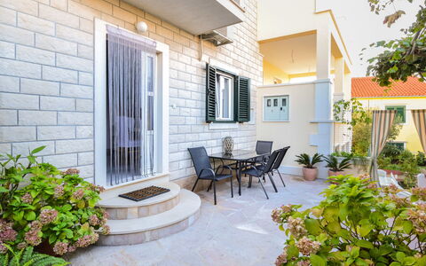 Brač Supetar 620: Plant, Building, Property, Furniture, Window, Flowerpot, Chair, Lighting, Shade, Architecture