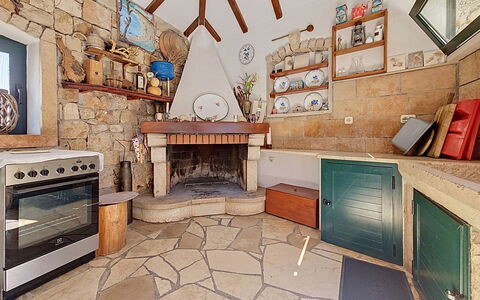 Brač Supetar 620: Flooring, Tile, Flagstone, Stone Wall, Chair, Wood Stain, Kitchen, Houseplant, Cabinetry