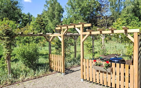 Trollstua: Wood, Shrub, Garden, Fence, Shade, Backyard, Wood Stain, Outdoor Structure, Pergola, Hardwood