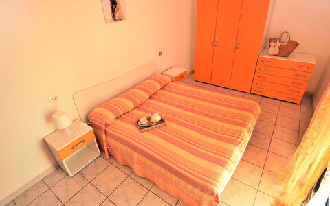 Vistamare: Comfort, Orange, Wood, Interior Design, Pillow, Bed Frame, Building, Outdoor Furniture, Flooring, Floor