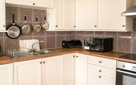Old School: Cabinetry, Countertop, Kitchen Appliance, Kitchen Stove, Black, Kitchen, Building, Wood, Cooktop, Home Appliance