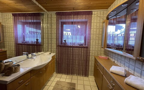Achentaler Fewo Inkl. Spabereich: Mirror, Tap, Plumbing Fixture, Sink, Wood, Bathroom Cabinet, Bathroom, Bathroom Sink, Interior Design, Lighting