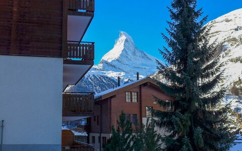 Shangri la: Sky, Building, Daytime, Property, Snow, Window, Light, Azure, Mountain, Slope