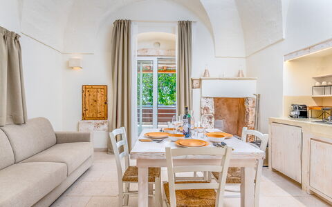 La Torretta - Corte dei Messapi: Table, Furniture, Property, Cabinetry, Chair, Countertop, Azure, Wood, Building, Interior Design
