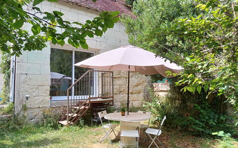 La Petite Maison Blanche: Plant, Table, Botany, Shade, Building, Window, Outdoor Table, Outdoor Furniture, Umbrella, Land Lot