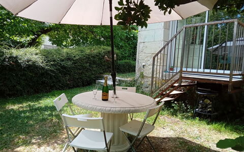 La Petite Maison Blanche: Plant, Furniture, Property, Table, Light, Umbrella, Chair, Shade, Building, Outdoor Furniture