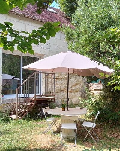 La Petite Maison Blanche: Plant, Table, Botany, Shade, Building, Window, Outdoor Table, Outdoor Furniture, Umbrella, Land Lot