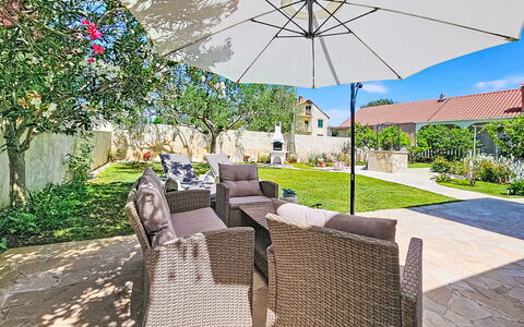 Tone: Umbrella, Outdoor Furniture, Furniture, Chair, Shade, Garden, Outdoor Table, Flagstone, Resort