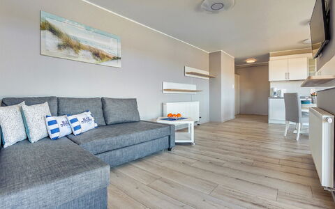 Resorts Kołobrzeg: Couch, Wood, Comfort, Interior Design, Floor, Flooring, Studio Couch, Living Room, Rectangle