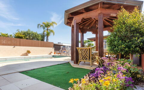 Masia Blanca: Garden, Landscaping, Shade, Resort, Yard, Eco Hotel, Backyard, Artificial Turf, Courtyard, Lawn