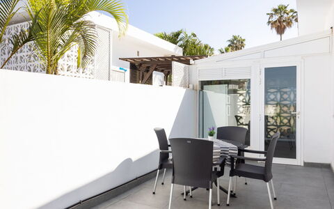 Las Aguilas: Property, Sky, Building, Shade, Tree, Chair, Architecture, Interior Design, Wall, Arecales