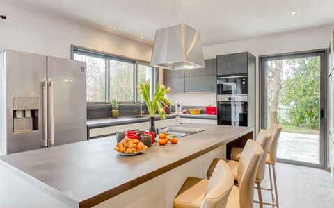 L'Allée Couverte: Cabinetry, Table, Countertop, Furniture, Property, Window, Chair, Kitchen Stove, Wood, Kitchen Appliance