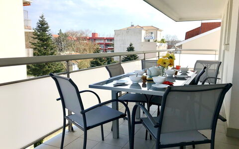 Neptune: Table, Furniture, Property, Countertop, Tableware, Cabinetry, Food, Plant, Window, Chair