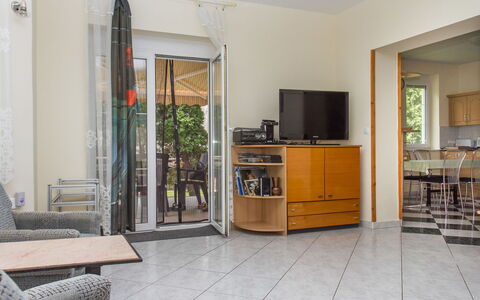 Leon: Cabinetry, Property, Furniture, Countertop, Building, Interior Design, Wood, Picture Frame, Houseplant, Floor