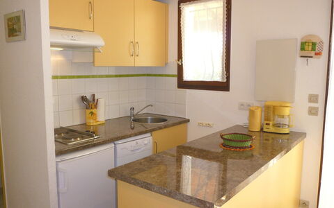 Les Lauriers Roses: Property, Room, Kitchen, Furniture, Yellow, Building, Countertop, House, Cabinetry, Real Estate