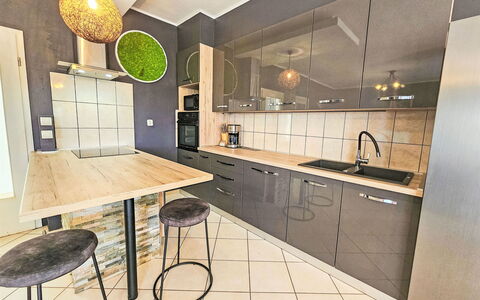 Joy on Countryside: Countertop, Cabinetry, Furniture, Property, Kitchen, Drawer, Chair, Wood, Lighting, Sink