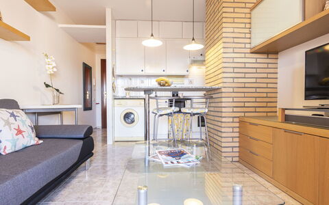 Torrepuerto: Furniture, Cabinetry, Table, Couch, Countertop, Lighting, Wood, Interior Design, Building, Flooring