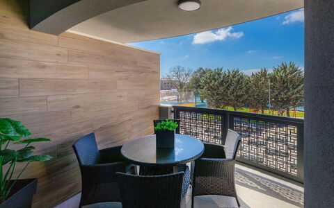 Wing 77: Furniture, Table, Property, Sky, Chair, Plant, Shade, Building, Cloud, Lighting