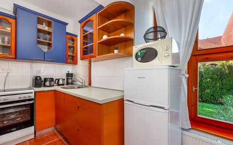 Kamilla: Cabinetry, Property, Kitchen Appliance, Countertop, Kitchen Stove, Home Appliance, Kitchen, Wood, Interior Design, Orange