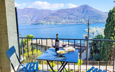 Brissago 724: Furniture, Outdoor Furniture, Chair, Coastal And Oceanic Landforms, Balcony, Outdoor Table, Sea, Mountain Range, Coast, Shade
