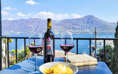 Brissago 724: Drinkware, Table, Furniture, Mountain Range, Wine, Barware, Restaurant, Stemware, Sea