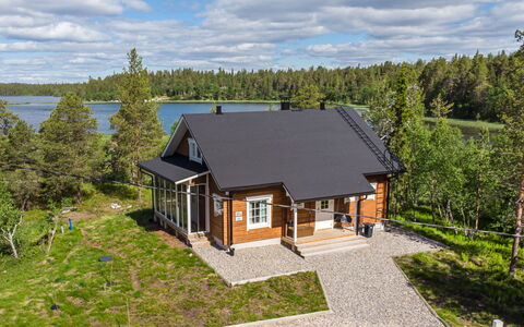 Villa Tunturisopuli: Furniture, Chair, Outdoor Furniture, Table, Wood, Outdoor Table, Kitchen & Dining Room Table, Shade, Garden, Umbrella