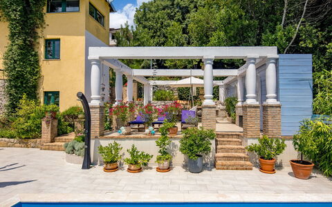Nika: Flowerpot, Swimming Pool, Column, Resort, Shade, Porch, Outdoor Structure, Garden, Houseplant, Patio