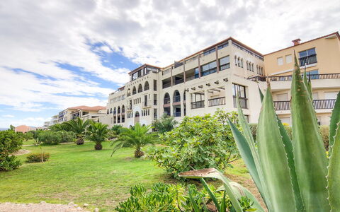 Catalona: Cloud, Plant, Sky, Building, Plant Community, Window, Tree, Land Lot, Natural Landscape, Grass