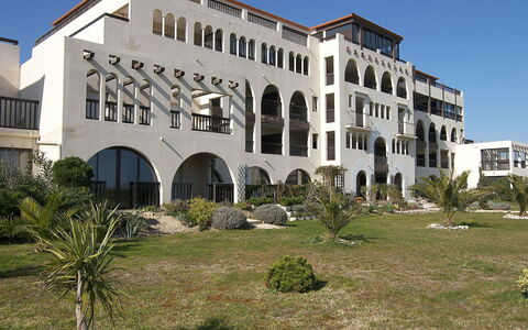 Catalona: Plant, Sky, Building, Property, Window, Land Lot, Residential Area, Real Estate, Facade, Urban Design