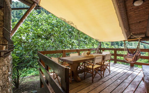 Al Fopp: Table, Furniture, Plant, Shade, Wood, Outdoor Furniture, Lighting, Outdoor Table, Chair, Building