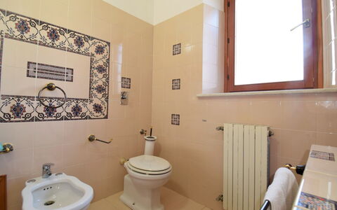 Le Palme: Plumbing Fixture, Property, Toilet Seat, Window, Toilet, Bathroom Sink, Bathroom, Purple, Interior Design, Wood