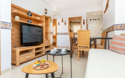 Cala Blanca i: Interior Design, Furniture, Flooring, Apartment, Home, Floor, Room, Picture Frame, Living Room, Ceiling