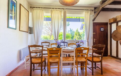 Les Figuiers: Table, Furniture, Property, Chair, Window, Plant, Wood, Interior Design, Lighting, Yellow