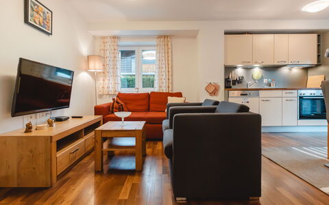 Kaprun 605: Furniture, Property, Television, Comfort, Table, Interior Design, Lighting, Wood, Building, Couch