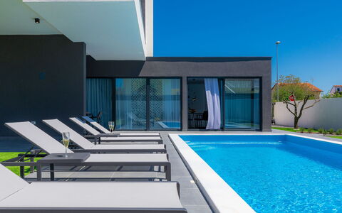 Dots N' Stripes: Building, Property, Water, Sky, Azure, Swimming Pool, Shade, Window, Interior Design, Architecture