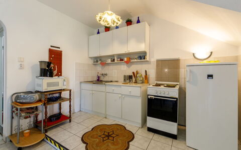 Csilla: Cabinetry, Property, Countertop, Kitchen Appliance, Gas Stove, Kitchen, Kitchen Stove, Home Appliance, Wood, Interior Design