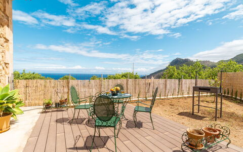 Sa Caseta des Camp: Cloud, Sky, Plant, Property, Building, Furniture, Flowerpot, Natural Environment, Table, Wood