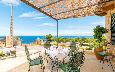 Sa Caseta des Camp: Table, Plant, Sky, Cloud, Furniture, Daytime, Property, Chair, Azure, Nature