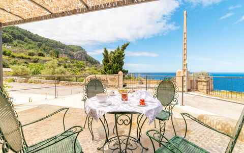 Sa Caseta des Camp: Cloud, Table, Furniture, Property, Water, Sky, Chair, Nature, Shade, Interior Design