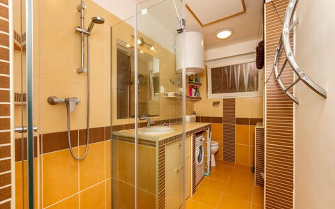 Lampion: Shower Door, Shower Head, Cabinetry, Interior Design, Wood, Shower, House, Floor, Flooring