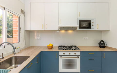 Mirror: Kitchen, Kitchen Appliance, Countertop, Cabinetry, Major Appliance, Interior Design, Kitchen Stove, Flooring, Wood, Stove
