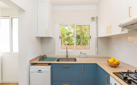 Mirror: Kitchen, Major Appliance, Countertop, Kitchen Appliance, Kitchen Sink, Wood, Cabinetry, Interior Design, Furniture, Home